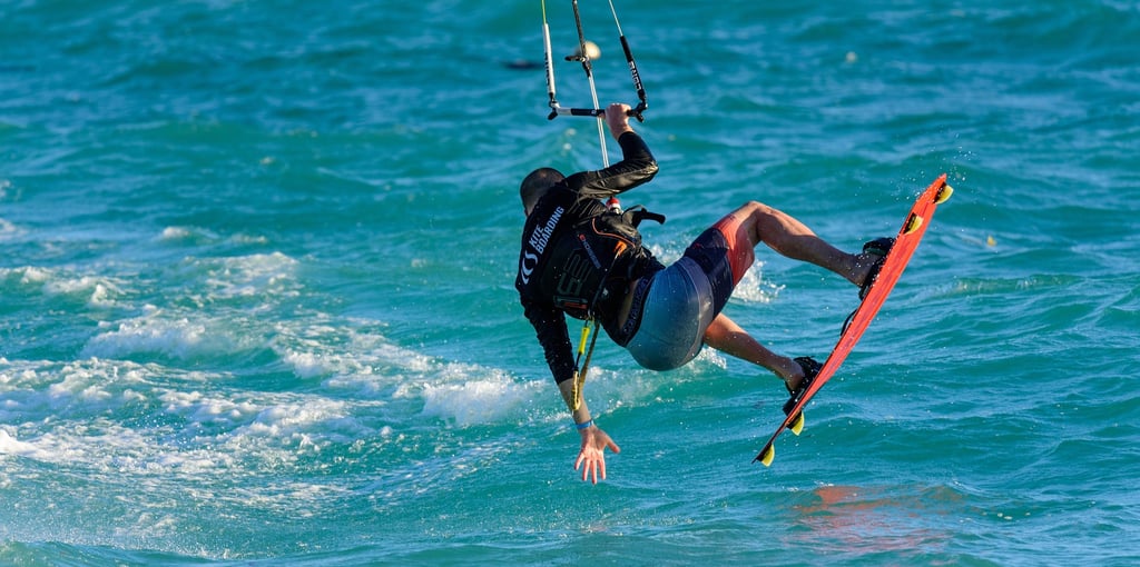 Man kitesurfing over turquoise water in the Dominican Republic