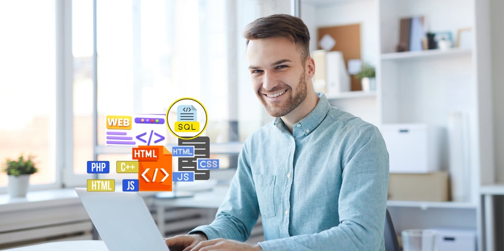 a man sitting at a table with a laptop as a freelance web designer