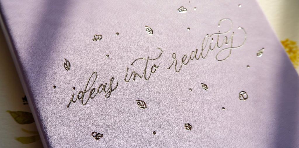 A leather journal customized with hot foiling by NYC calligrapher Handwritten by Belle.