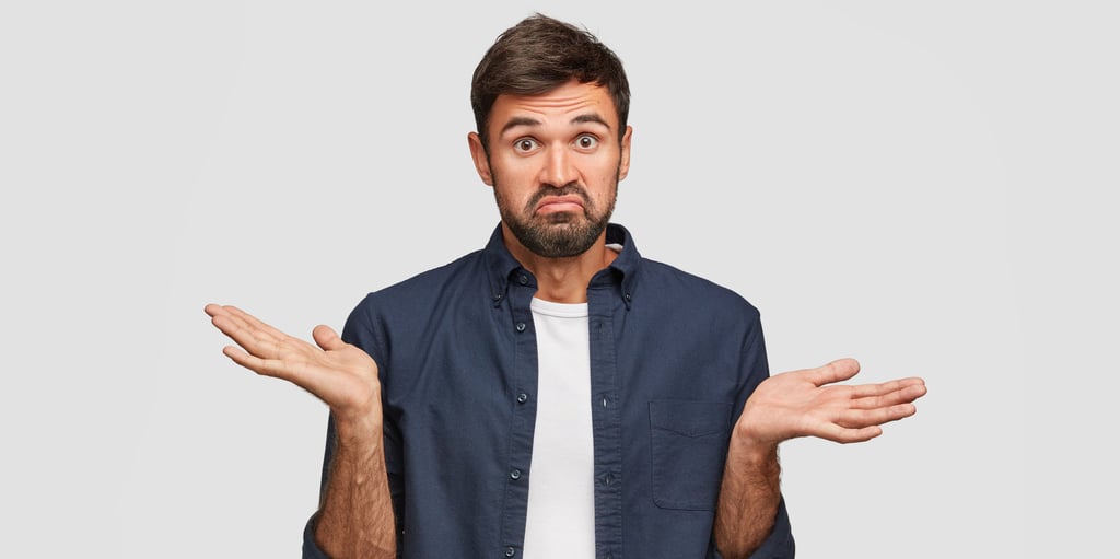 a man with a beard and a beard, holding his hands out and looking surprised