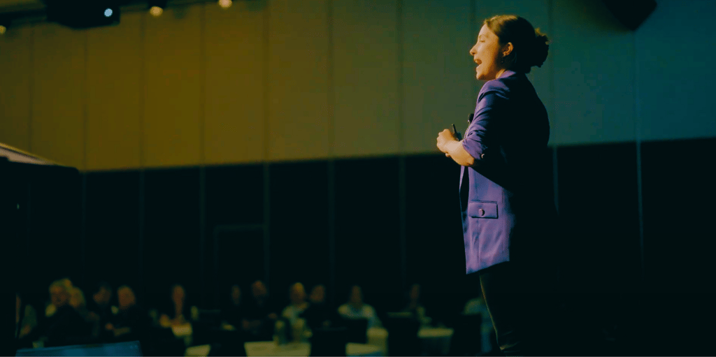 Fun Motivational Speaker Evelina Bereni on stage