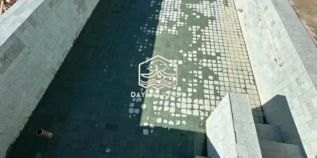 finising batu alam andesit kolam renang.