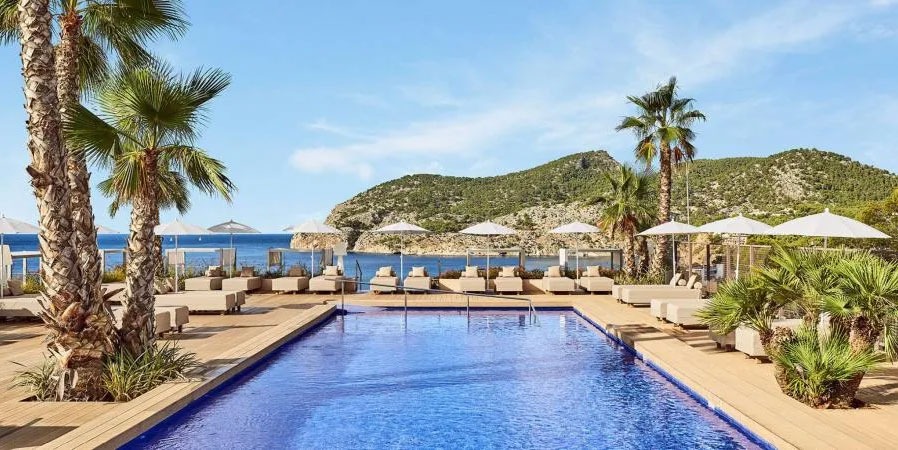 Rooftop Swimming Pool, Palm Trees and Sun Loungers at Zafiro Palace Andratx