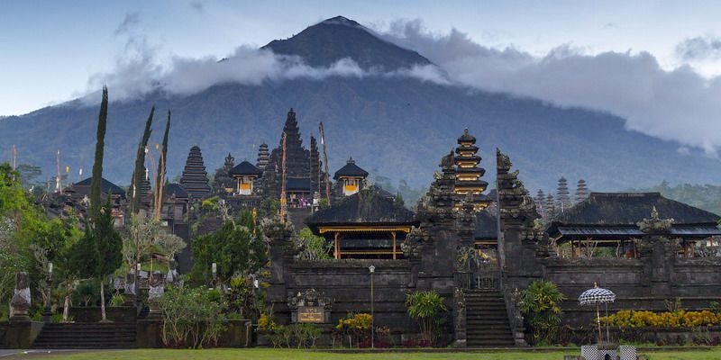 Traditional Balinese architecture at Besakih Temple surrounded by lush mountain scenery