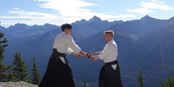 Aikidō and kenjutsu training with wooden swords (bokken) emphasizing timing, distance and ki.