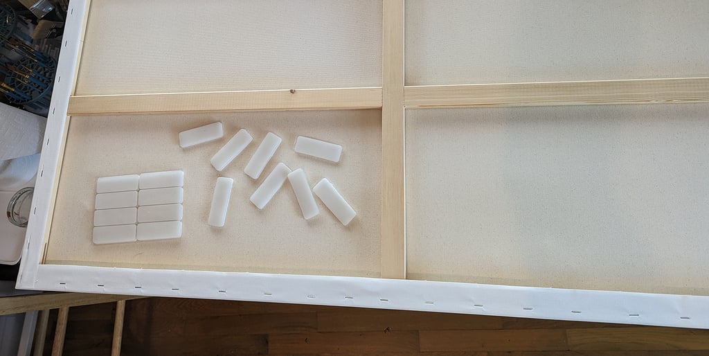 The back of a stretch canvas showing how Velcro hanging tabs will be applied.