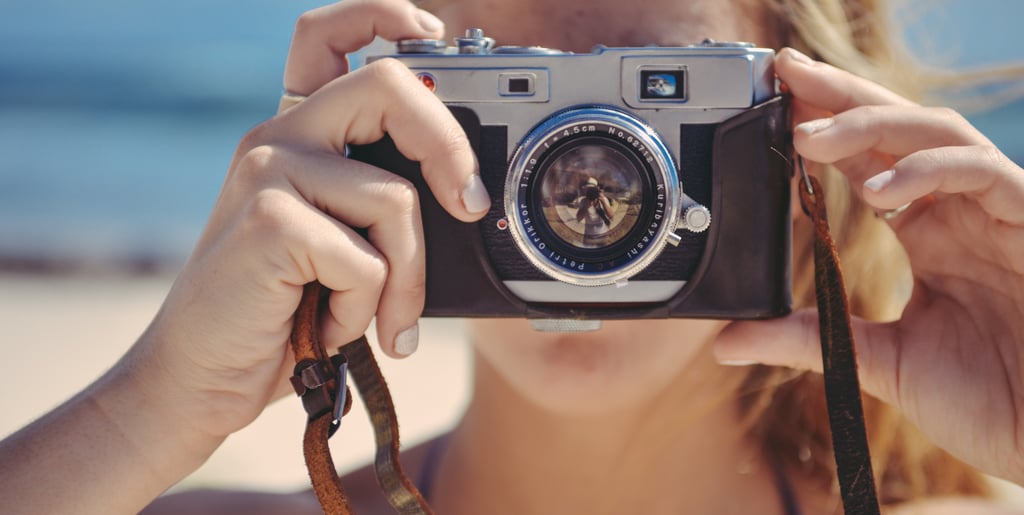 a woman taking a picture of herself taking a picture of herself