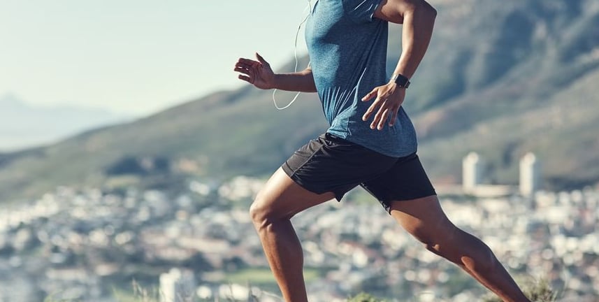 a man running on a mountain trail