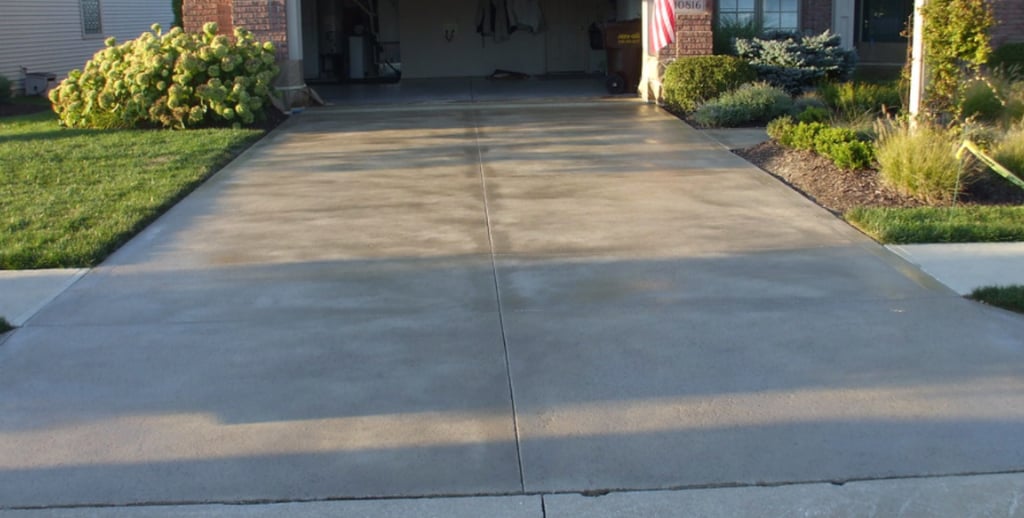 a driveway with a driveway and driveway with a flag