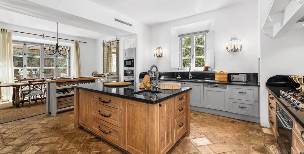 Kitchen view with island and wooden floors at Finca Santa Katerina