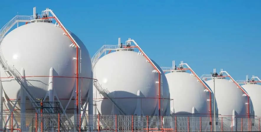 a row of white Gases tanks
