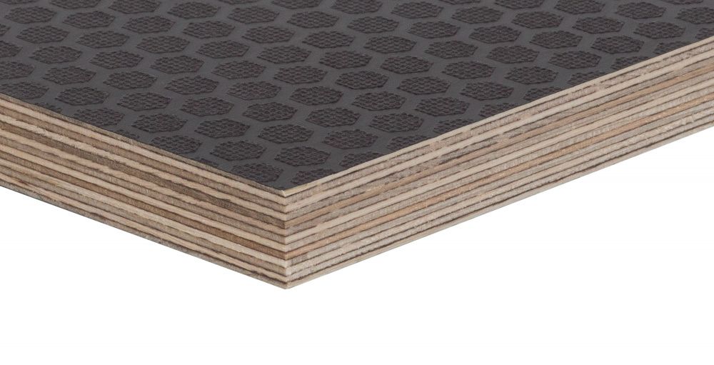 Non-slip birch plywood sheet with a black hexagonal pattern surface for industrial flooring.