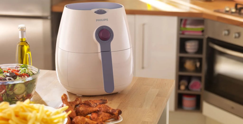 a kitchen counter top with a bowl of fries and a bowl of fries, first look the Phillips Airfryer