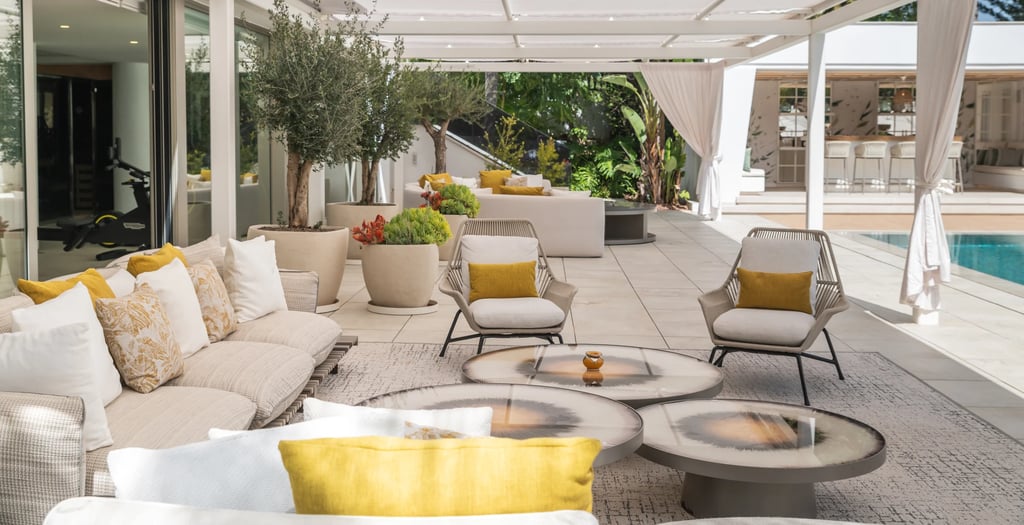 Pool area at Villa Serenity featuring modern furnishings, sunbathing lounges, and chill-out areas