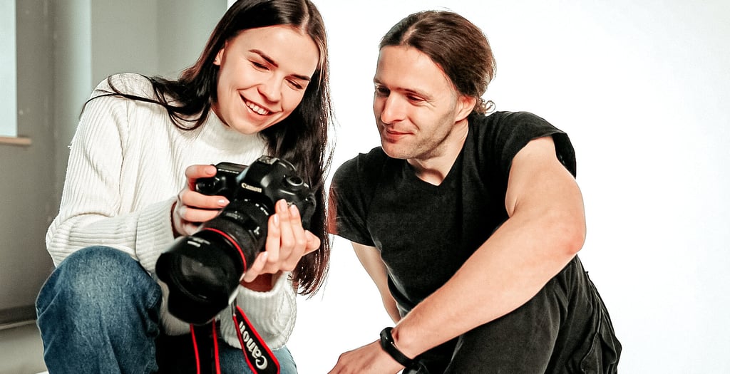 Photographer engaging with a client in a professional studio setting