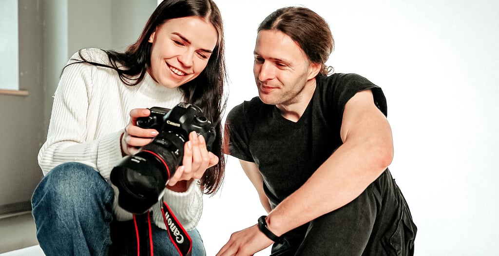 Photographer engaging with a client in a professional studio setting