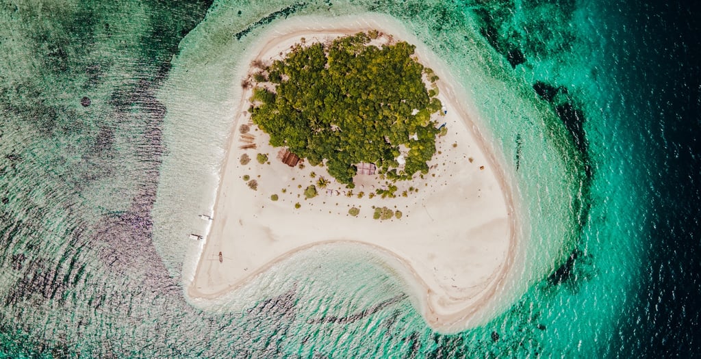 a small island with a small island in the middle of the ocean