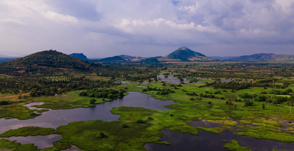 a view of a river and mountains in the distance