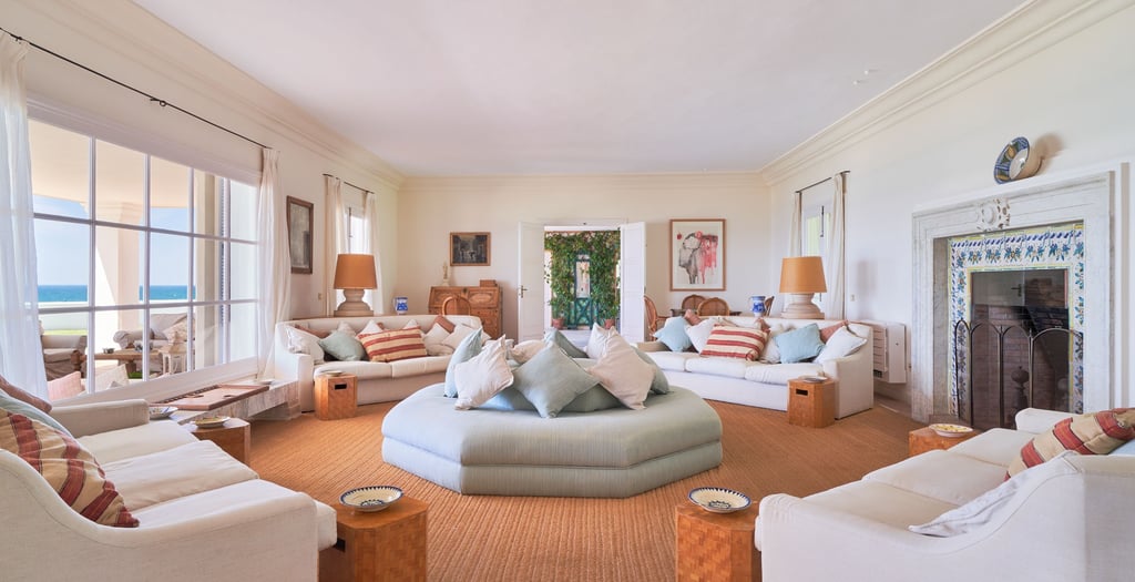 Spacious living room with fireplace and ocean views