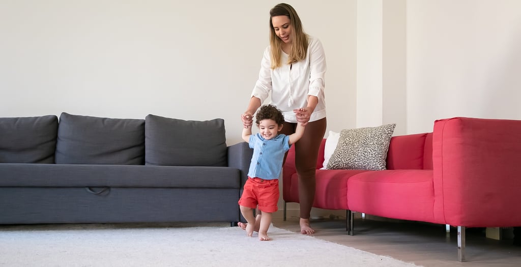 Mother and child enjoying a clean carpet in a bright living room in Melbourne, FL