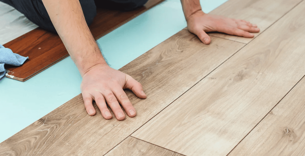 Flooring installer is installing floating type flooring.