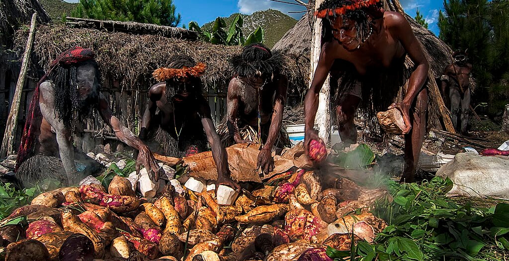 cooking method uses a pit in the ground combined with heated stones
