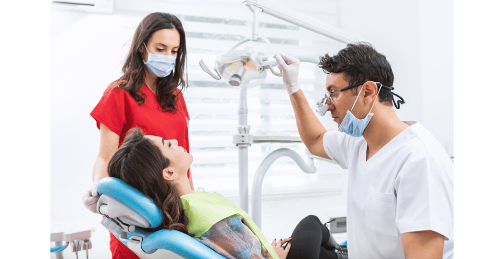 Dentist and assistant treating a patient in a modern dental clinic. Professional dental care in Turkey with expert consultati