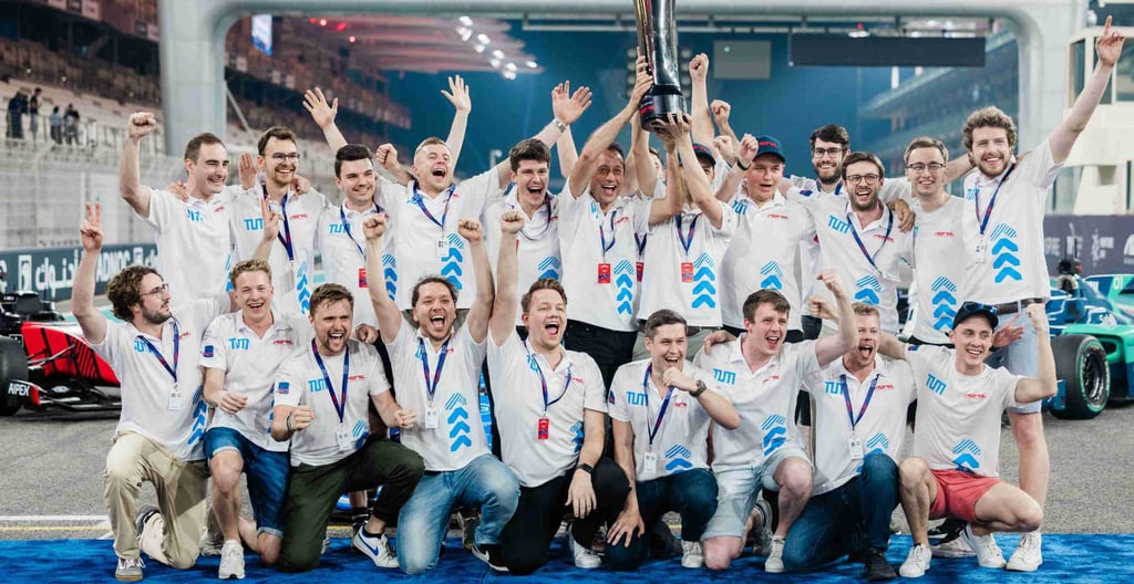 a group of people standing around a trophy