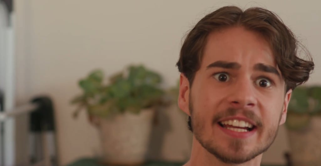 a man with a beard and a beard, smiling and looking at the camera