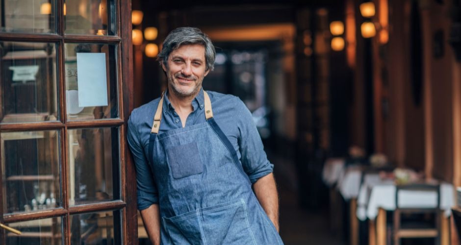 Small business owner in a blue apron and aprons