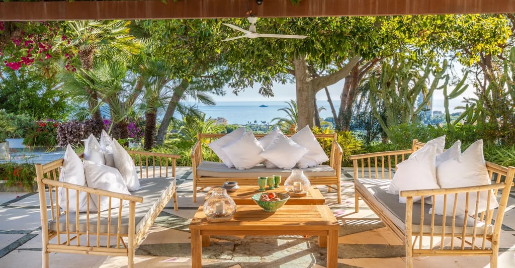 Covered terrace lounge with sea views and outdoor seating