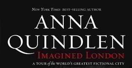 a bus stop sign in front of a bus stop