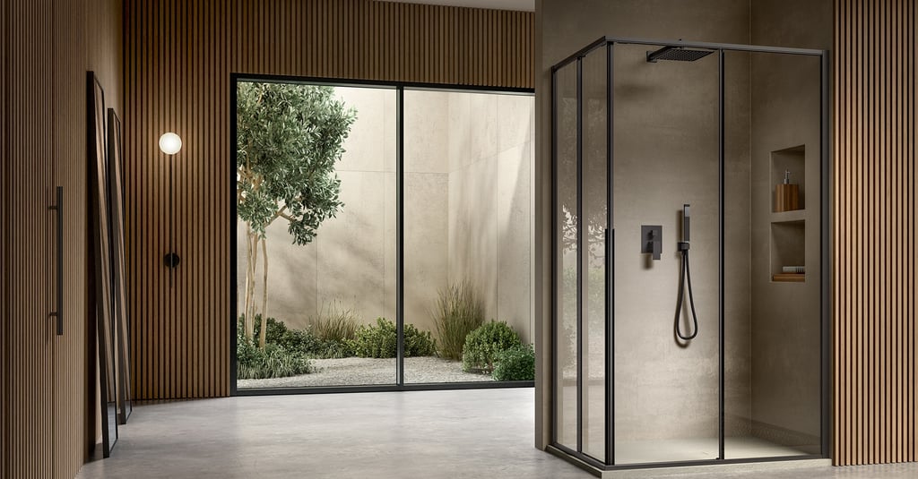 a bathroom with a glass shower and a shower