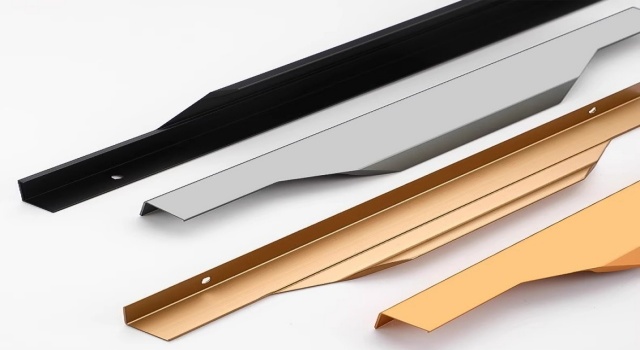 Thumb pull cabinet handles in black, silver, and gold – sleek hardware for cabinet or drawer doors.