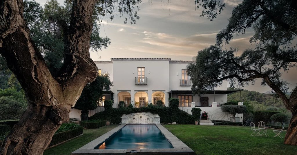 Symmetrical garden with pool at sunset