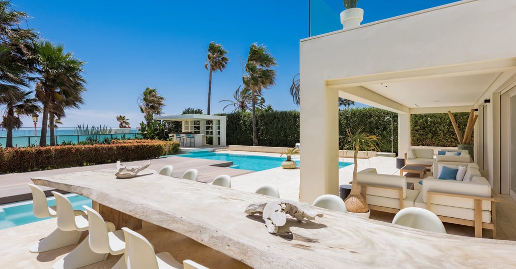Covered terrace lounge with pool and garden