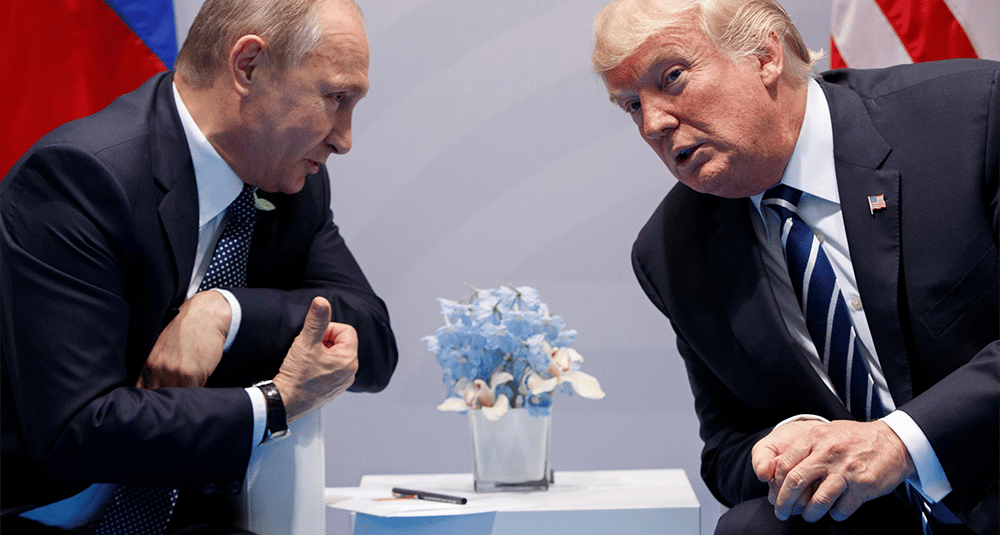 a man in a suit and tie is talking to a woman