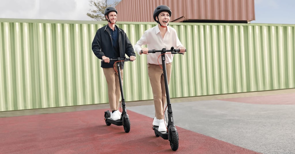 a man and woman riding scooters on a sidewalk