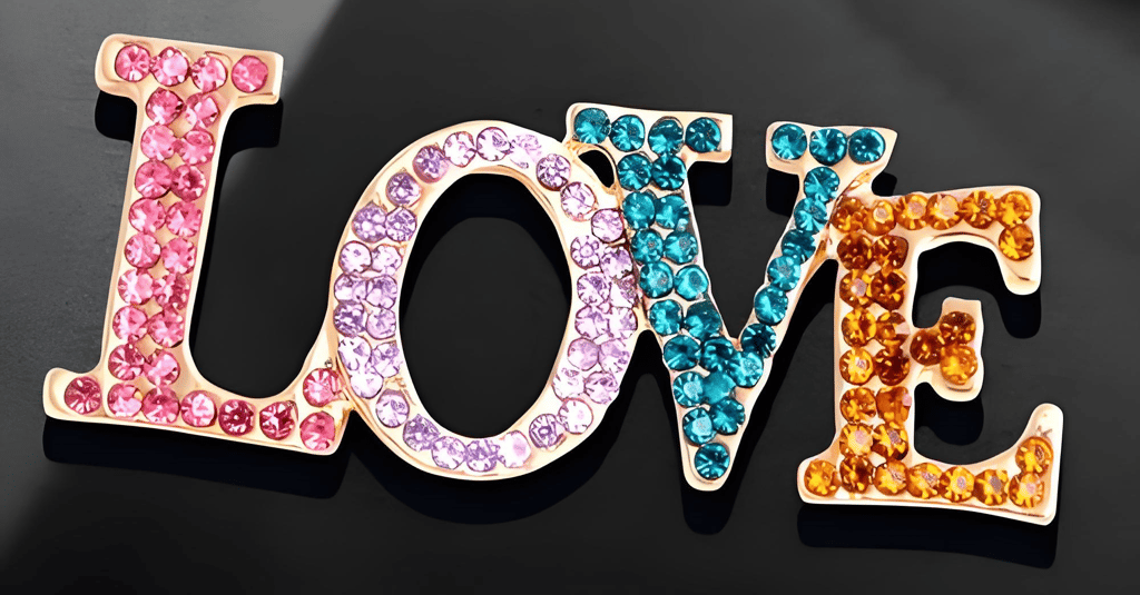 Gemstone finish enamel pin with translucent jewel-like depth and polished metal reflections for premium custom pin designs