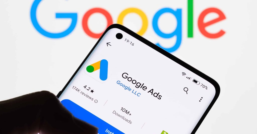 man holding phone google ads