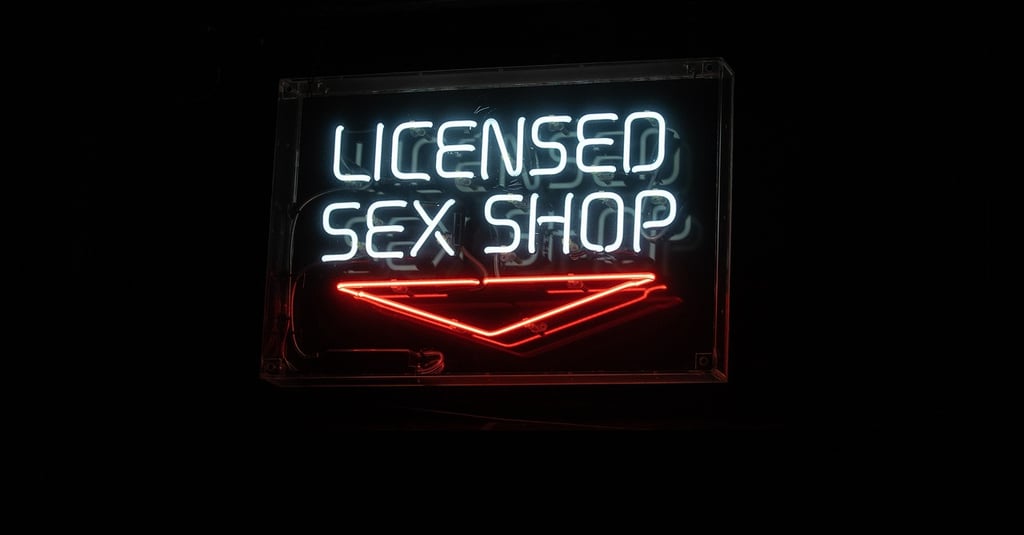 neon sign that reads licensed sex shop
