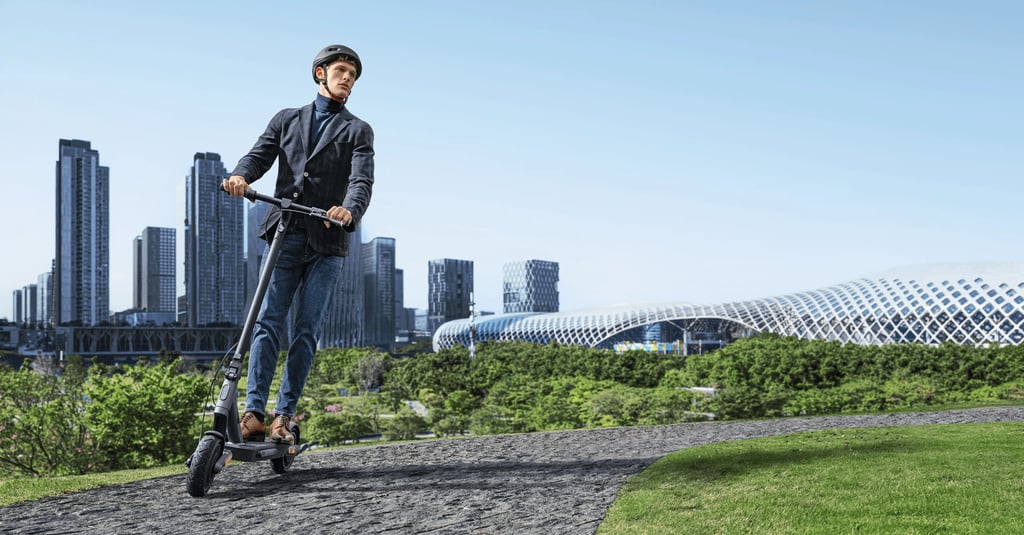 a man riding a scooter in a city