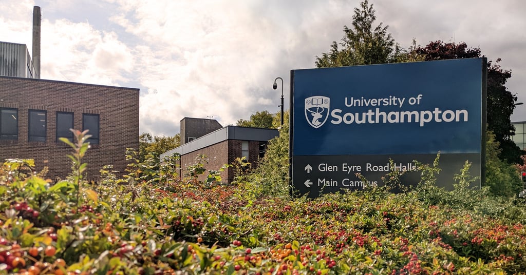 University of Southampton signboard with buildings and greenery in the backgroun