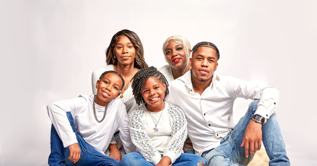 image of smiling children in a family wearing white shirt and jeans who live in the Washington DC