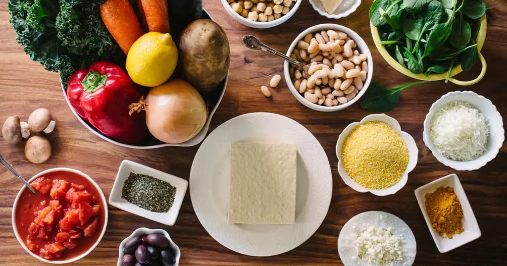 a table with bowls of food and vegetables