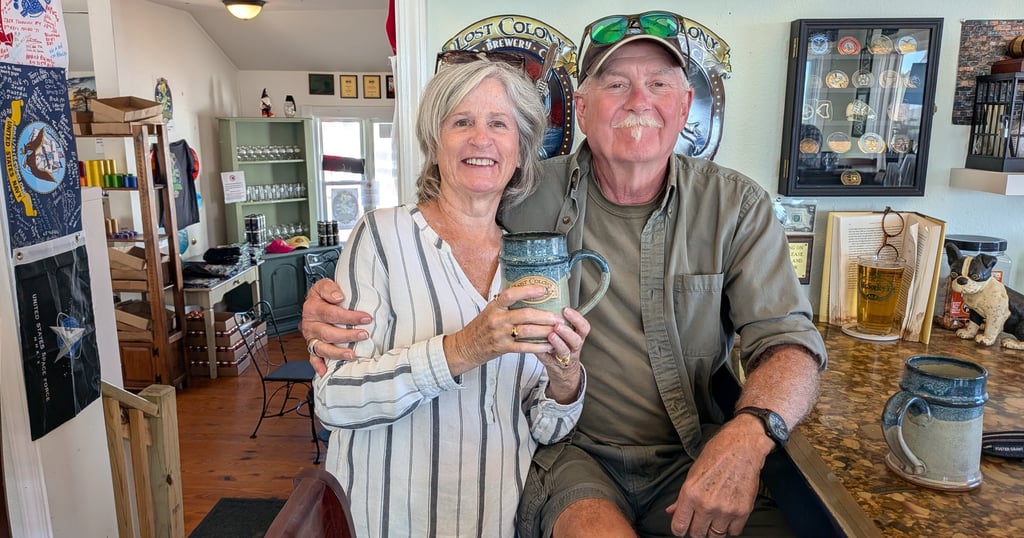 Maggie and Pete sitting at the bar with their special mugs