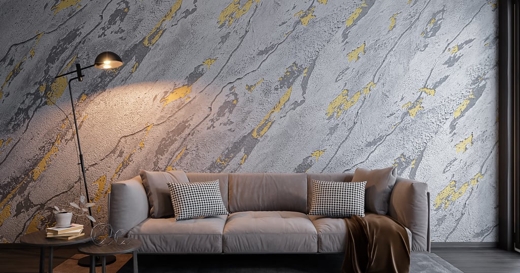 Pokój wykończony betonem architektonicznym. Połączenie szarości i złota daje efekt kamienia naturalnego