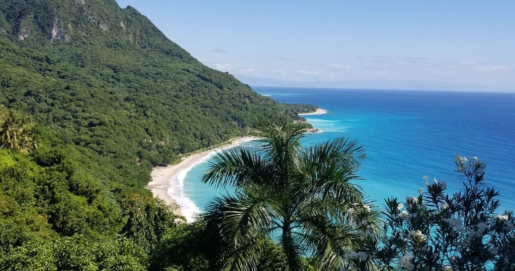 Tropical coastline and lush green mountains in Barahona, Dominican Republic