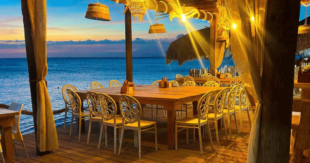 Open-air oceanfront restaurant at sunset in Cabo Rojo, Pedernales, Dominican Republic