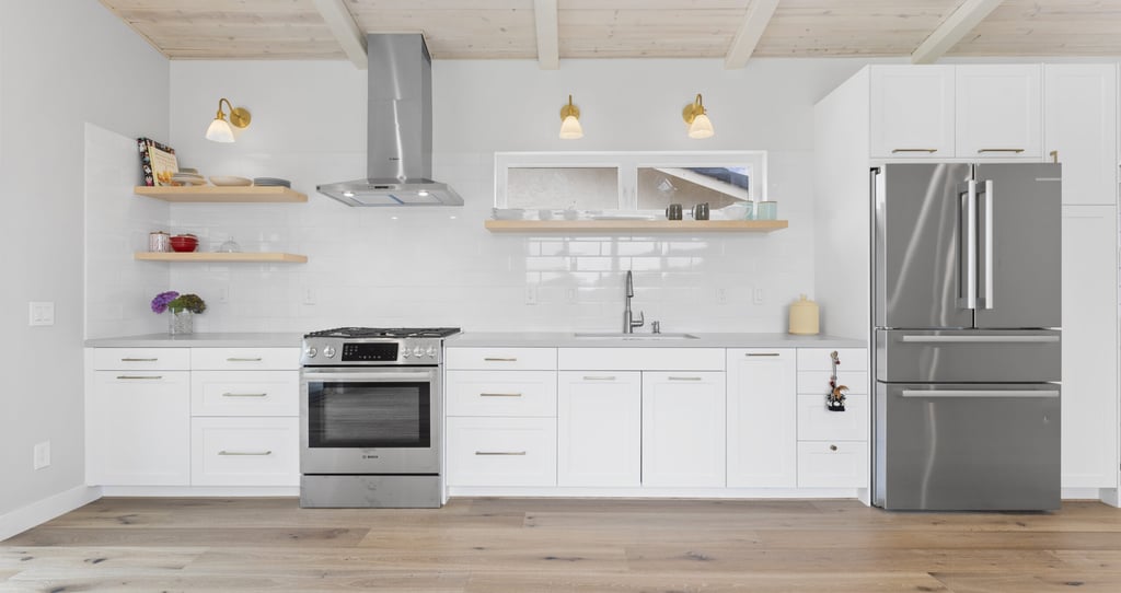 a kitchen with a refrigerator, stove, and a refrigerator
